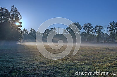 Autumnal dawn over rural meadows. Stock Photo