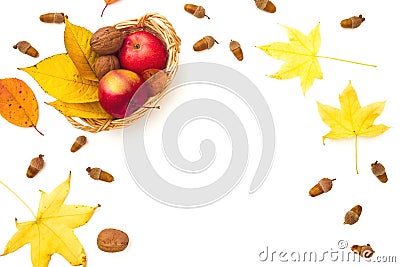 Autumnal frame composition. Fall leaves, apple and walnut on white background. Autumn, thanksgiving concept. Flat lay Stock Photo