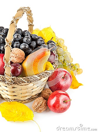 Autumnal fruit in basket Stock Photo