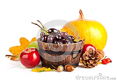 Autumnal harvest fruits and vegetables with yellow leaves Stock Photo