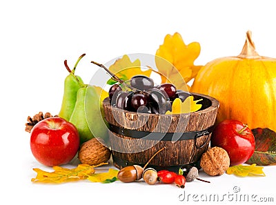 Autumnal harvest fruits and vegetables with yellow leaves Stock Photo