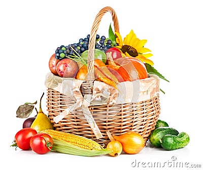 Autumnal harvest vegetables and fruits in basket Stock Photo