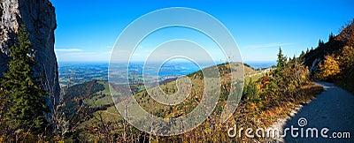 Autumnal hiking trail Kampenwand mountain with view to lake Chiemsee, upper bavaria Stock Photo