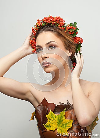 Autumnal woman. Beautiful creative makeup and hair style in fall concept studio shot. Beauty fashion model girl with fall makeup Stock Photo