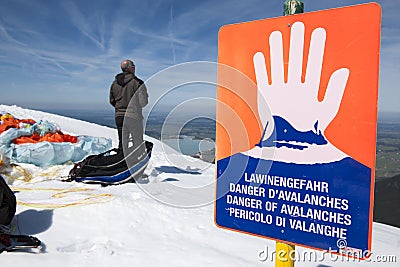 Avalanche danger sign with man horizontal Editorial Stock Photo