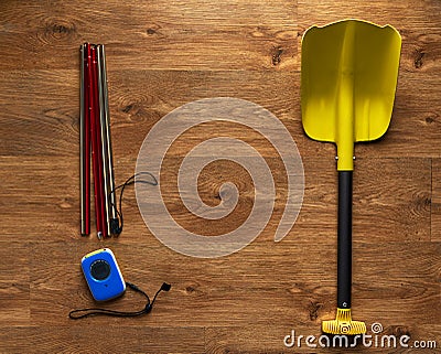 Avalanche rescue kit, lying on wooden floor. Stock Photo