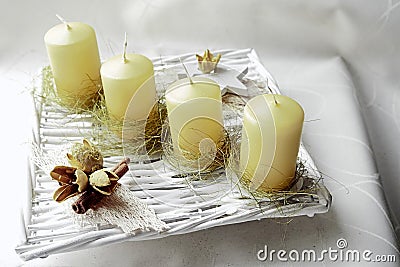 Avantgarde home made advent wreath with line of yellow candles Stock Photo