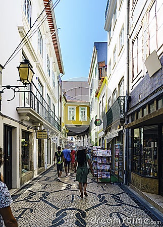 Aveiro, Portugal / August 23, 2017: Classical facade of the village very decorated with pink mosaics representing flowers in Editorial Stock Photo