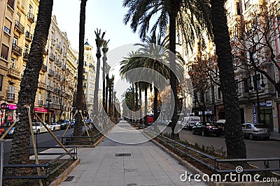 Avenida del Reino de Valencia during gardening and transplanting palm trees Editorial Stock Photo