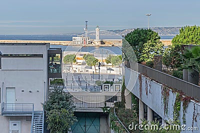 Avenue Vaudoyer and the entrance to the Old Port with the lighthouse Saint Marie in Marseille, France Editorial Stock Photo