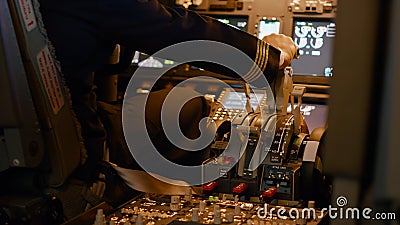 Aviation crew flying airplane with engine lever to throttle Stock Photo