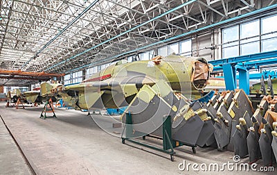 Aviation factory of military aircraft. Assembly of the Russian fighter. Focus on the cockpit Stock Photo