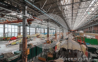 Aviation factory of military aircraft. Assembly of the Russian multirole fighter. Room with many pla Stock Photo