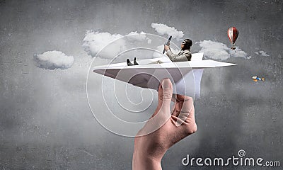 Aviator in paper plane. Mixed media Stock Photo