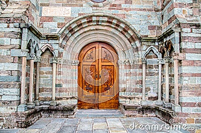 Avigliana, Italy, March 9, 2013: the carved wood door at the entrance of the Sacra of Saint Michael church. Stock Photo