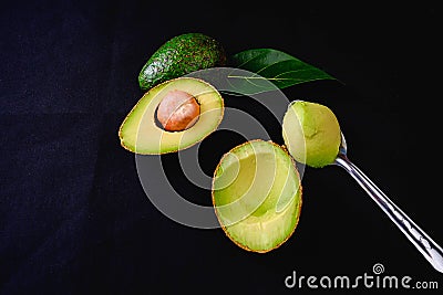 Avocado fruit and avocado leaves Stock Photo