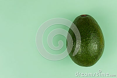 Avocado on green background Stock Photo