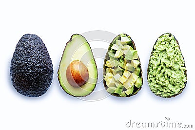 Avocado halves with guacamole, diced and whole fruit, healthy food concept Stock Photo