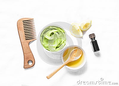 Avocado, honey hair homemade mask on light background, top view. Natural products for hair health Stock Photo