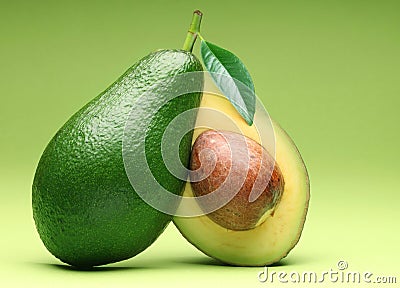 Avocado isolated on a green. Stock Photo