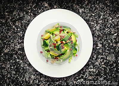 Avocado Salad, Green Salat with Avocado Slices, Cucumber, Broccoli, Pomegranate Top View Stock Photo