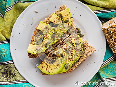 Avocado sandwich for healthy snack with seeds Stock Photo