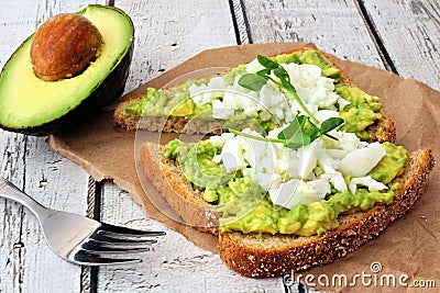Avocado toast with egg whites and pea shoots Stock Photo