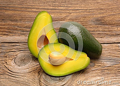 Avocados on a wood table Stock Photo