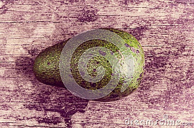 Avocatto on wood background color toned Stock Photo