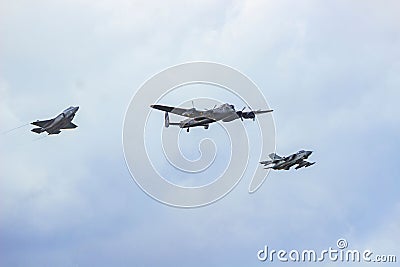 Avro Lancaster, A Panavia Tornado and a F35 Lightning II fly over the Imperial War Museum of Duxford Editorial Stock Photo