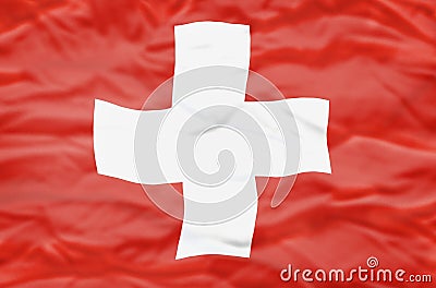 Switzerland flag on a wavy background. W Stock Photo
