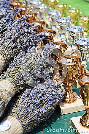 Award cups and lavender bouquets Stock Photo