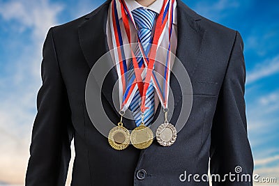 Awarded successful businessman is wearing many medals Stock Photo