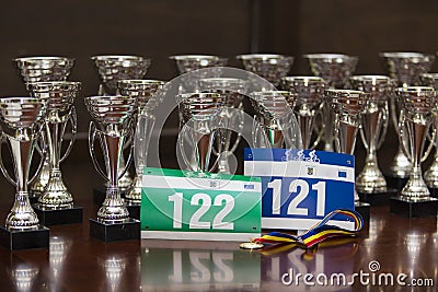 Race numbers, participation medal, and awards Stock Photo