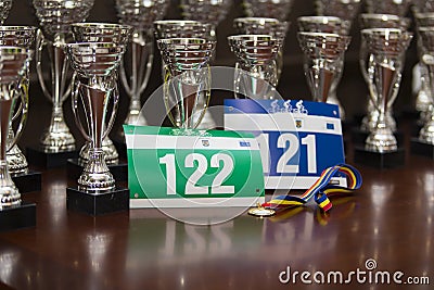 Race numbers, participation medal, and awards Stock Photo