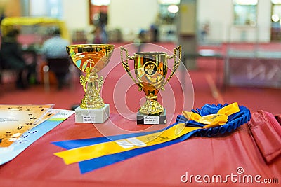 Award cups, ribbon, and diplomas Stock Photo