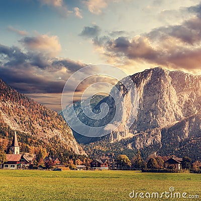 Awesome alpine highlands at sunset. Altaussee village surrounded by Rocky Mountains in Autumn. Colorful sky over the Trisselwand Stock Photo