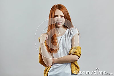 Awesome ginger female model in stylish clothes posing to the camera Stock Photo
