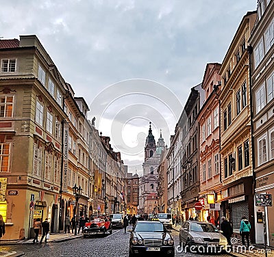 Prague in the evening, Streets, Steet Light, Walking around, Colorful buildings, Windows, Shops, Cars Editorial Stock Photo