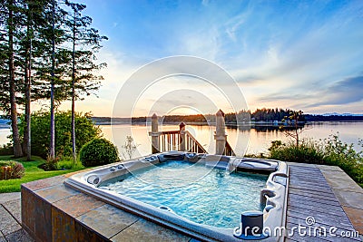 Awesome water view with hot tub in summer evening. Stock Photo