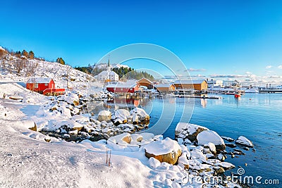 Awesome winter scenery of Moskenes village with ferryport and famous Moskenes parish Churc Stock Photo