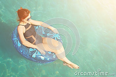 Woman relax on inflatable ring in sea water Stock Photo