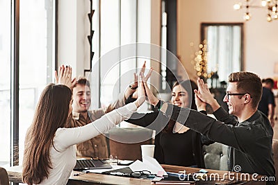 Awesome work we did. Having fun in the office room. Friendly coworkers playing around and celebrating success Stock Photo