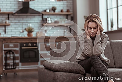 Mature woman feeling awful after divorce with husband Stock Photo