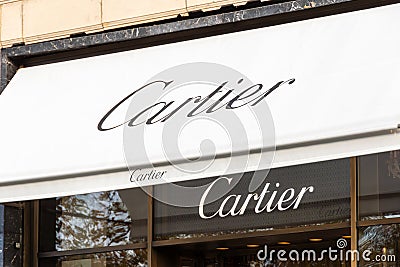 Awning and sign of the Cartier boutique on Avenue des Champs-Elysées, Paris, France Editorial Stock Photo
