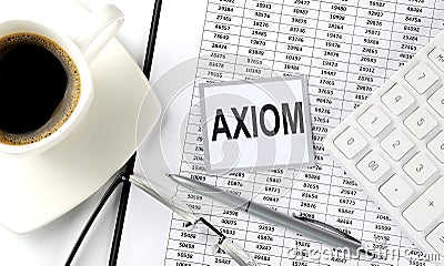 AXIOM text on sticky on the chart with coffee,pen and calculator Stock Photo
