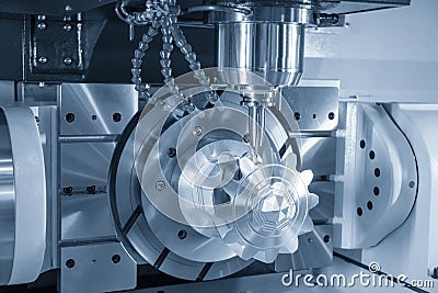 The 5-axis CNC milling machine cutting the sample of aluminium parts by solid ball endmill tools. Stock Photo