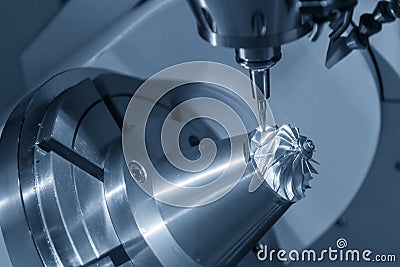 The 5-axis CNC milling machine cutting the turbine part with the taper ball endmill tool. Stock Photo