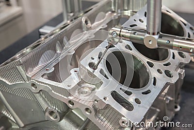 5-axis measurement probe is measuring the cylinder block Stock Photo