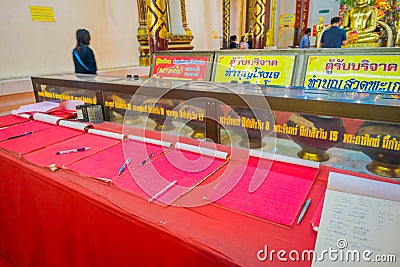 AYUTTHAYA, THAILAND, FEBRUARY, 08, 2018: Unidentified people walking inside of a building close to a golden budha statue Editorial Stock Photo